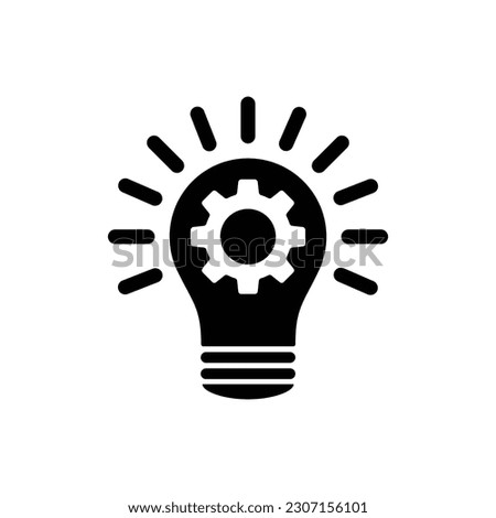 Light bulb with gears black silhouette icon