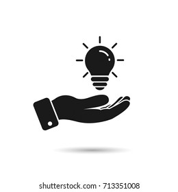 Light bulb in hand icon. Vector isolated illustration.