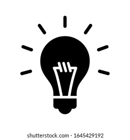 light bulb icon designed in solid style
