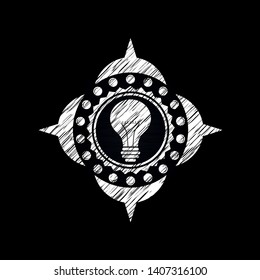 light bulb icon drawn on a chalkboard