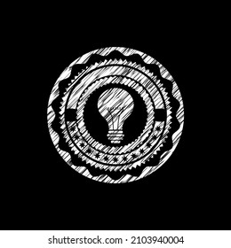 light bulb icon drawn on a blackboard. 