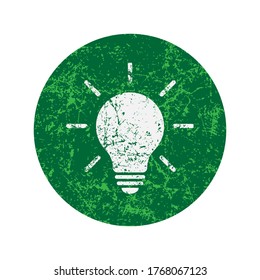Light bulb icon with grunge texture. Incandescent lamp symbol. Idea and innovation sign. Creative energy or inspiration logo. Black silhouette. Isolated on white background. Vector illustration image.