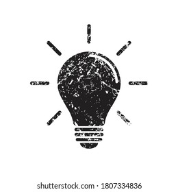 Light bulb icon with grunge texture. Incandescent lamp symbol. Idea and innovation sign. Creative energy or inspiration logo. Black silhouette. Isolated on white background. Lightbulb Vector illustrat