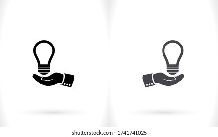 light bulb, icon. hand makes light. light bulb over hand. there is light in the hand. Vector EPS 10.