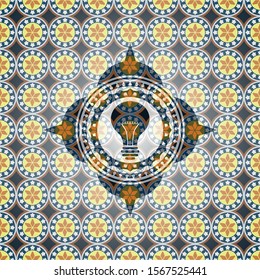 light bulb icon inside arabesque emblem background. arabic decoration.