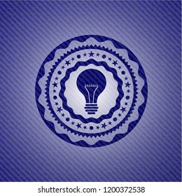 light bulb icon inside badge with denim background
