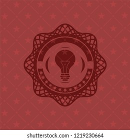 light bulb icon inside badge with red background