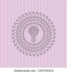 light bulb icon inside badge with pink background