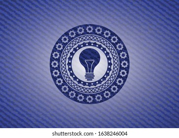 light bulb icon inside badge with denim texture