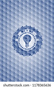 light bulb icon inside blue emblem or badge with abstract geometric polygonal pattern background.
