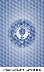 light bulb icon inside blue emblem with geometric pattern.