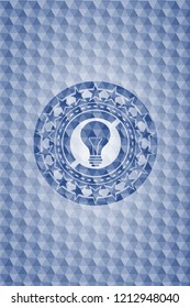 light bulb icon inside blue hexagon badge.