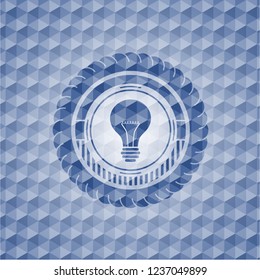 light bulb icon inside blue hexagon emblem.