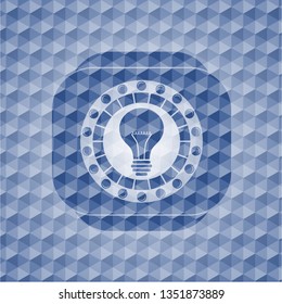  light bulb icon inside blue emblem or badge with abstract geometric polygonal pattern background.