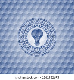 light bulb icon inside blue hexagon badge.