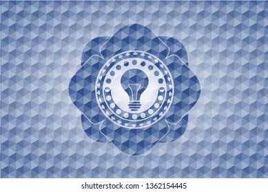 light bulb icon inside blue emblem with geometric background.