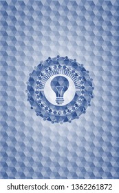 light bulb icon inside blue emblem or badge with geometric pattern background.