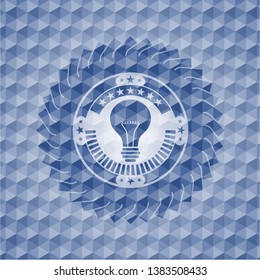 light bulb icon inside blue emblem with geometric pattern.