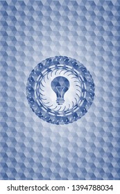 light bulb icon inside blue emblem with geometric pattern background.