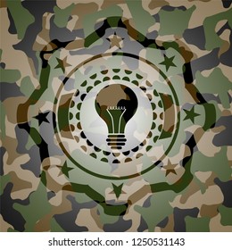 light bulb icon inside camouflaged emblem