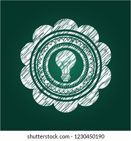 light bulb icon inside chalk emblem