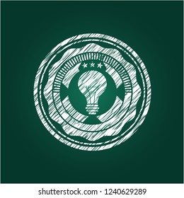 light bulb icon inside chalkboard emblem written on a blackboard