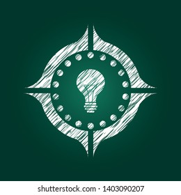 light bulb icon inside chalkboard emblem written on a blackboard