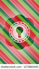 light bulb icon inside christmas badge.