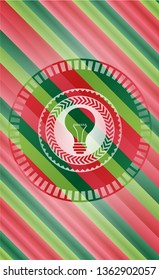 light bulb icon inside christmas colors badge.