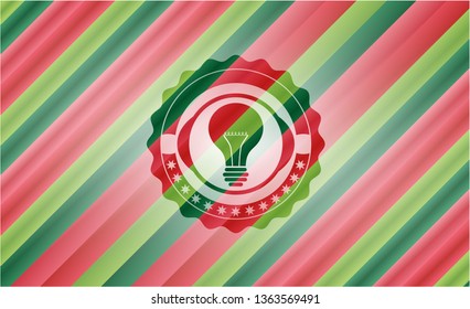 light bulb icon inside christmas colors style badge.