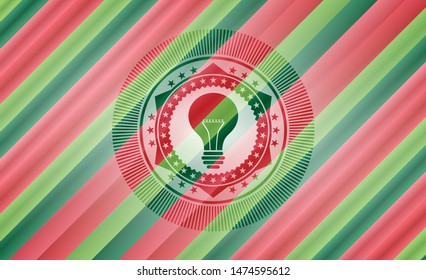 light bulb icon inside christmas badge.