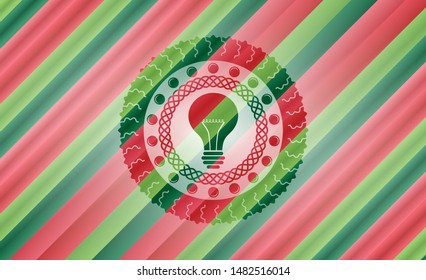 light bulb icon inside christmas style emblem.