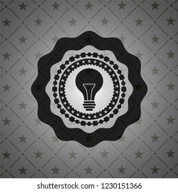 light bulb icon inside dark badge