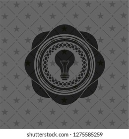 light bulb icon inside dark emblem. Retro