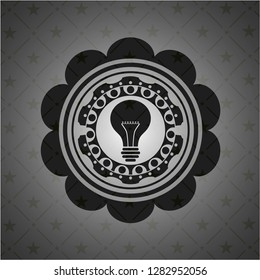 light bulb icon inside dark badge