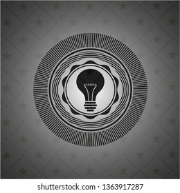 light bulb icon inside dark emblem. Retro