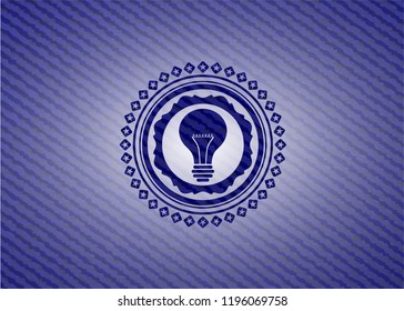 light bulb icon inside emblem with denim texture light bulb icon inside emblem with denim texture
