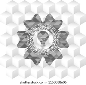 light bulb icon inside grey badge with geometric cube white background