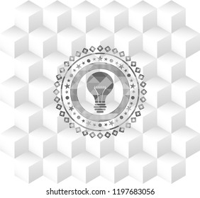  light bulb icon inside grey icon or emblem with geometric cube white background
