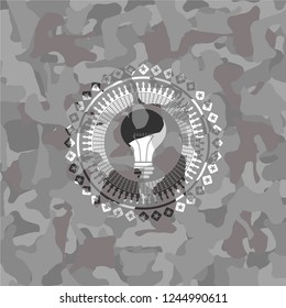 light bulb icon inside grey camo texture