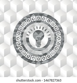 light bulb icon inside grey emblem. Retro with geometric cube white background