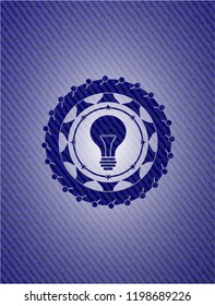 light bulb icon inside jean background