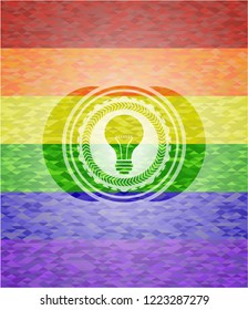 light bulb icon inside lgbt colors emblem 