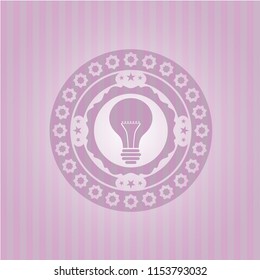 light bulb icon inside pink icon or emblem