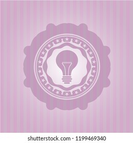 light bulb icon inside pink icon or emblem