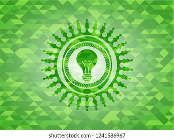 light bulb icon inside realistic green mosaic emblem