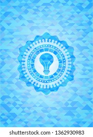 light bulb icon inside realistic sky blue emblem. Mosaic background