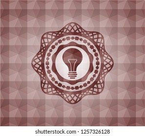 light bulb icon inside red seamless emblem or badge with geometric pattern background.