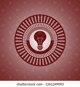light bulb icon inside red icon or emblem