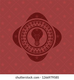 light bulb icon inside red icon or emblem